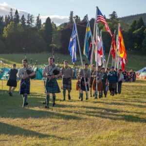 Explorer Scouts crossing the site at the Blair Atholl Jamborette opening Ceremony