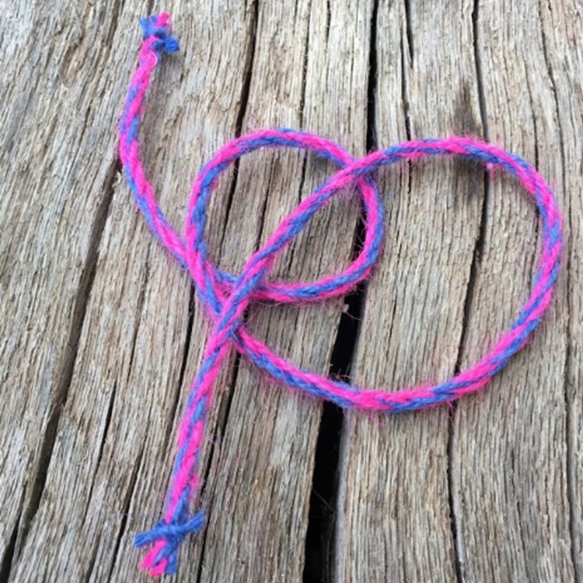 A photo of a pink and blue homemade rope